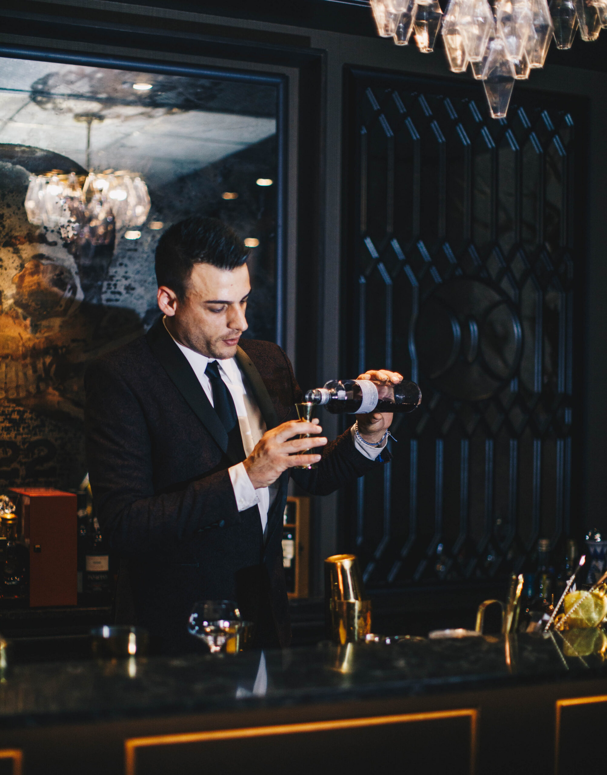 sommelier pouring wine