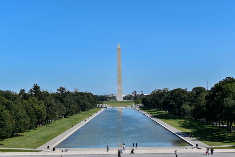 Washington Monument reflected in National Mall pool.