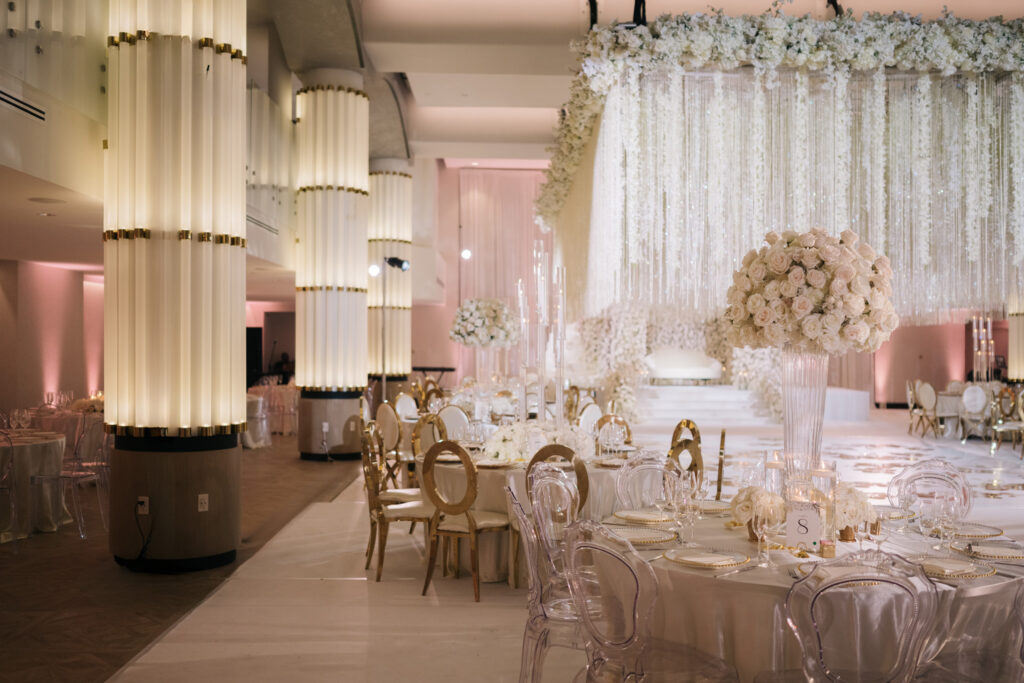 Grand wedding reception with lavish white décor.