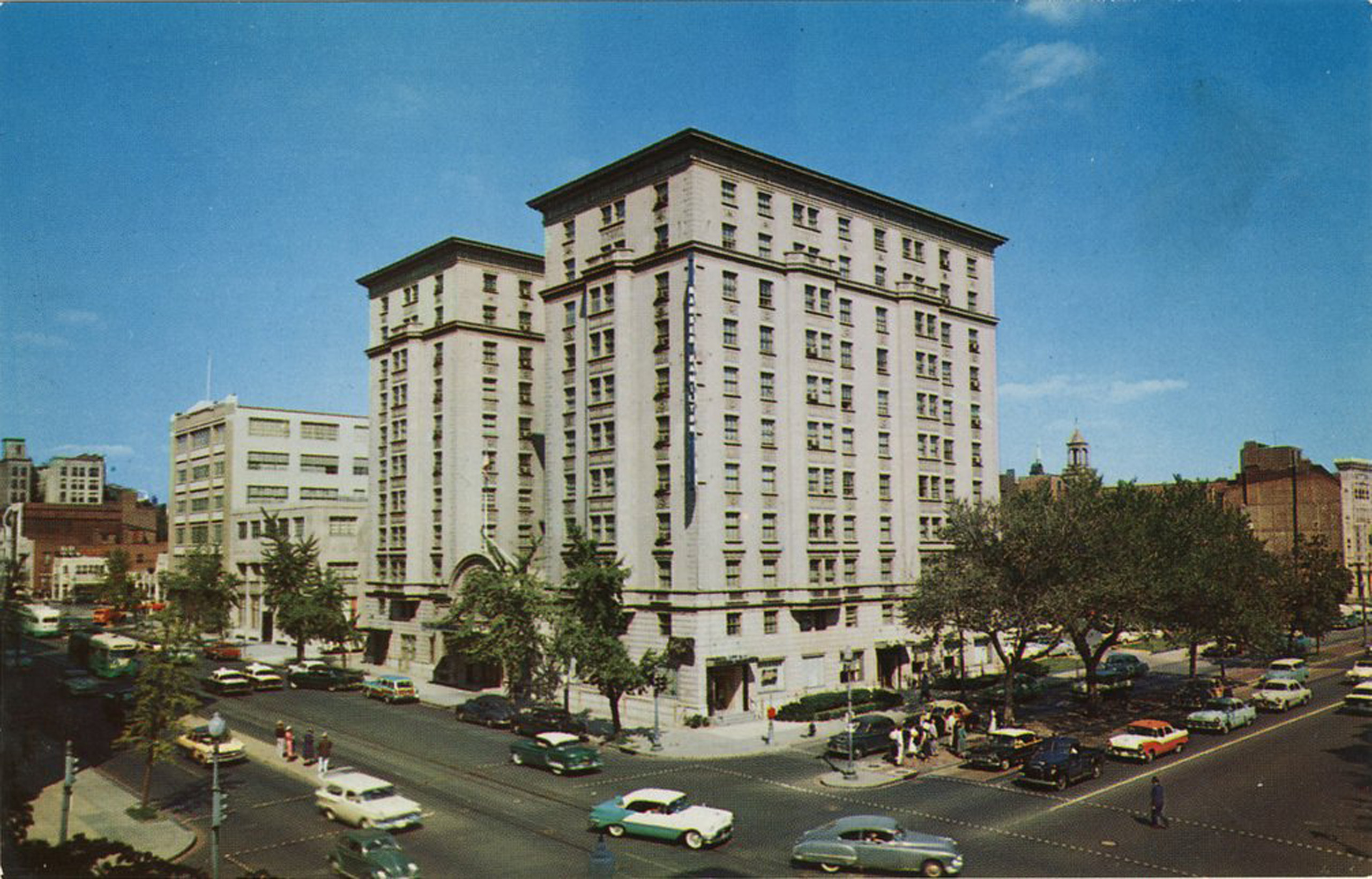 Historic Hamilton Hotel exterior with classic cars.