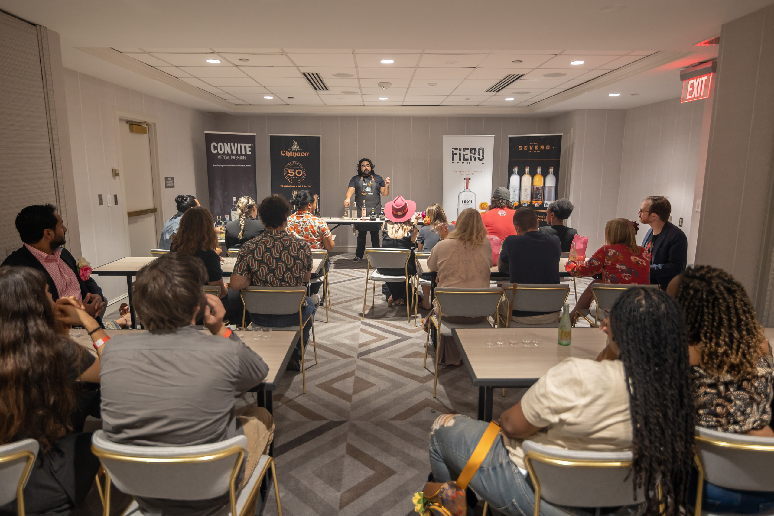 Tequila tasting seminar with seated attendees