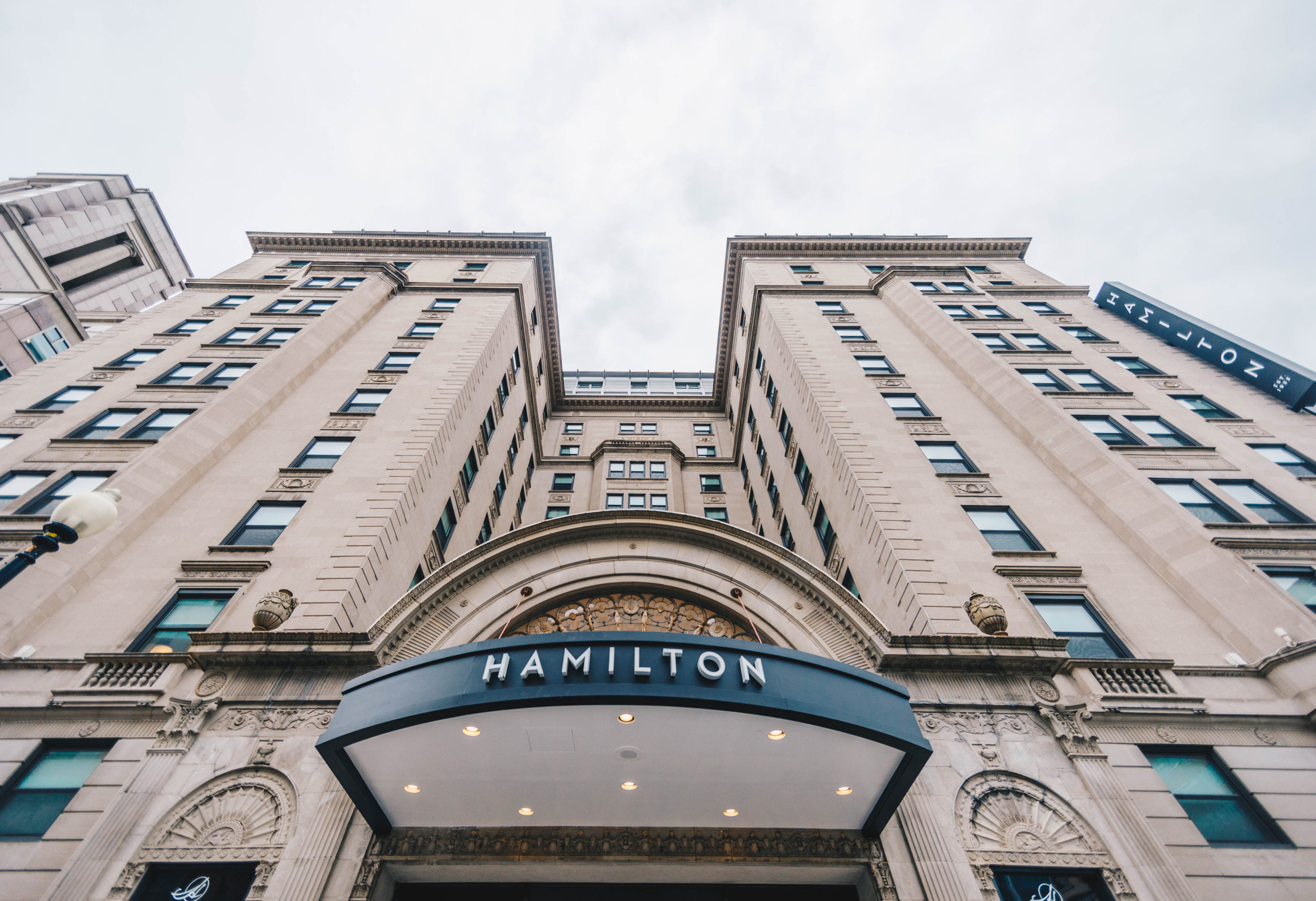 Hamilton Hotel entrance with blue canopy.