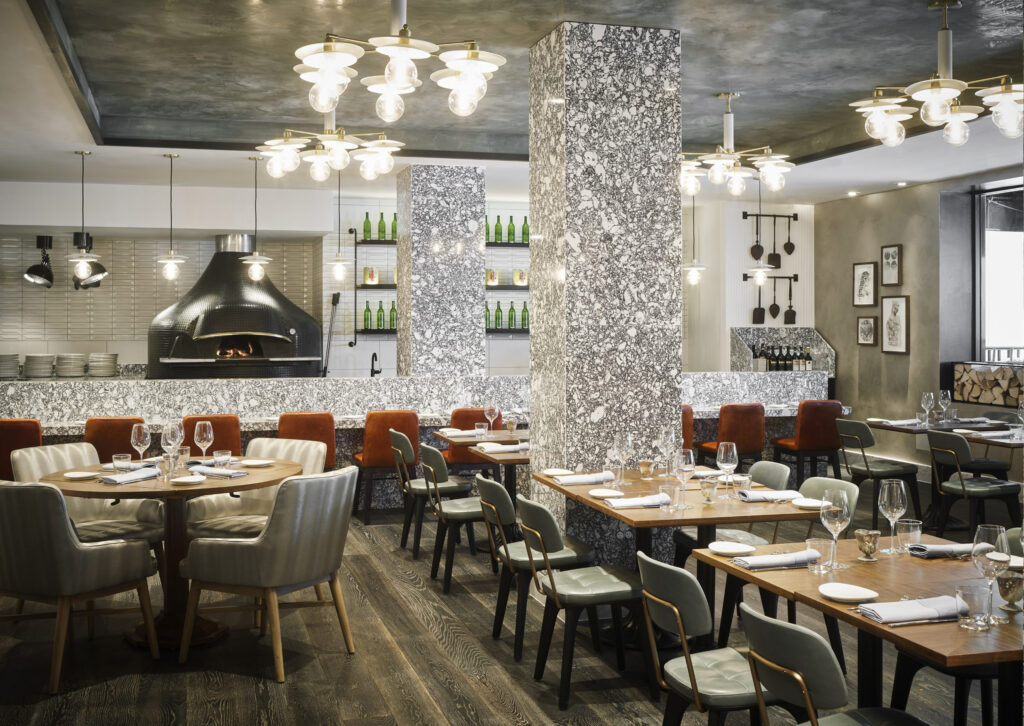 Modern Italian restaurant with open kitchen and wood-fired oven.