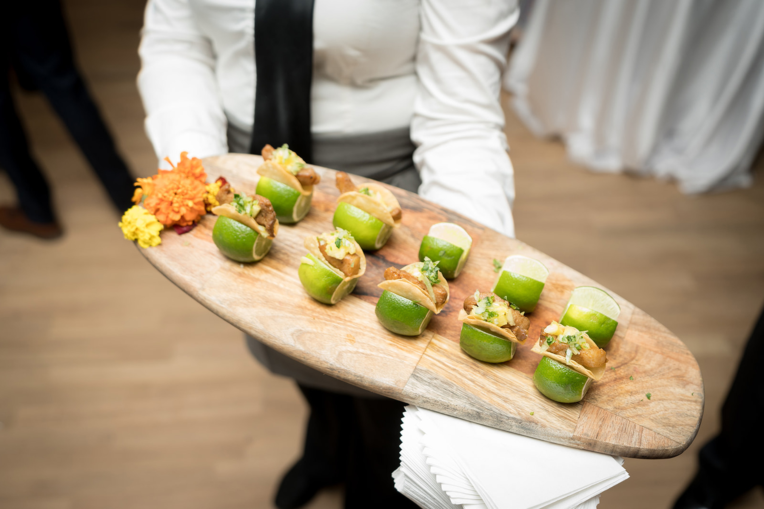 Passed appetizers served in halved limes.