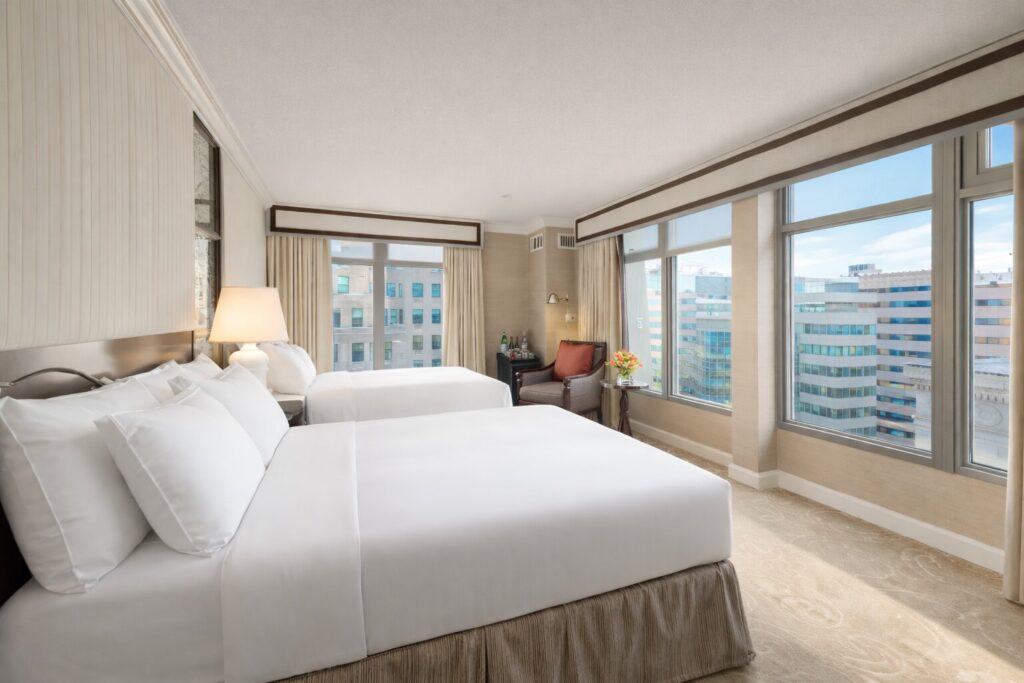 Double beds overlooking downtown skyline.