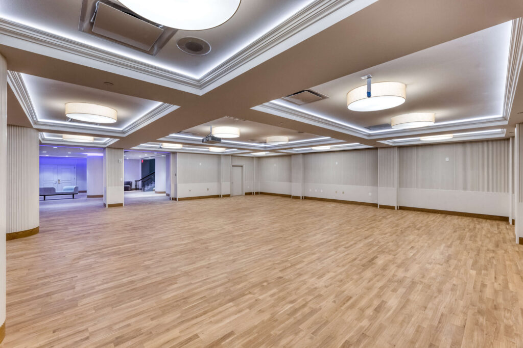 large meeting room with overhead and recessed lighting