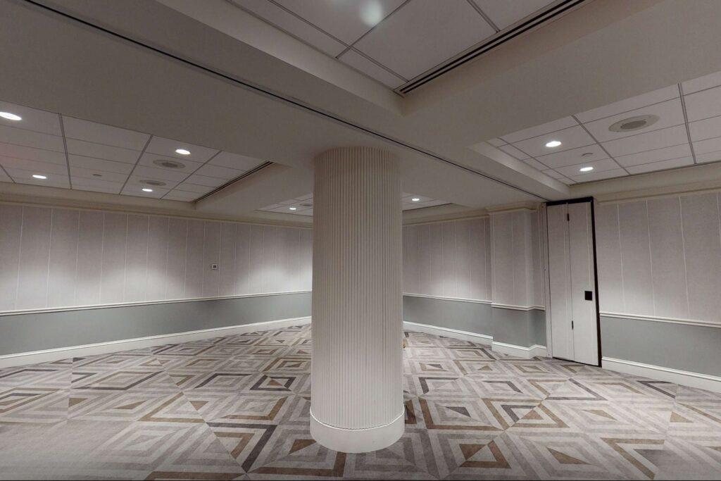 back area of a meeting room with grey carpet